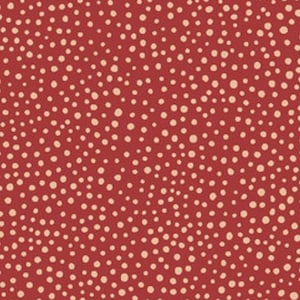 May include: Red fabric with a pattern of small, off-white dots. The dots are scattered across the surface, creating a speckled appearance. The fabric is likely cotton or a similar material, suitable for quilting or crafting projects.