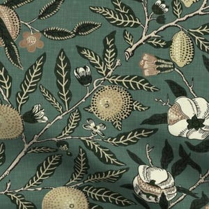 May include: Teal fabric with a repeating pattern of stylized fruit, flowers, and leaves. The design features beige and white fruit with dotted textures, white flowers, and dark green leaves and stems. The fabric has a vintage, botanical theme.