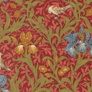 May include: A fabric with a repeating pattern of birds, irises, and foliage. The background is a deep red, with green leaves and stems. The irises are blue and gold, and the birds are tan and white. The fabric is measured in inches.
