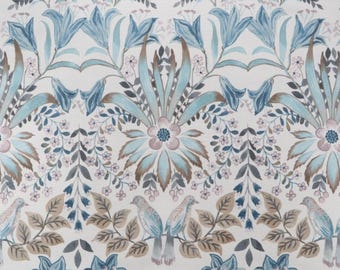 May include: Watercolor floral pattern in shades of blue, teal, brown, and pink on a cream background. The design features stylized flowers, leaves, and birds, creating a vintage aesthetic. Ideal for fabric or wallpaper.