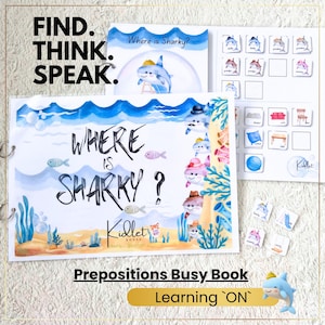 Könnte beinhalten: Ein spiralgebundenes Lernbuch mit dem Titel Where is Sharky? und Aquarellillustrationen von Haien, Fischen und Korallenriffen. Die Seiten enthalten interaktive Zuordnungskarten mit Beschriftungen für Familienmitglieder und Möbelstücke zum Sprachenlernen.