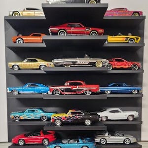 May include: A collection of miniature toy cars displayed on a black shelf. The cars are various colors, including red, blue, yellow, and silver. The shelf has multiple levels, showcasing the cars in an organized manner. The cars are detailed replicas of classic vehicles.