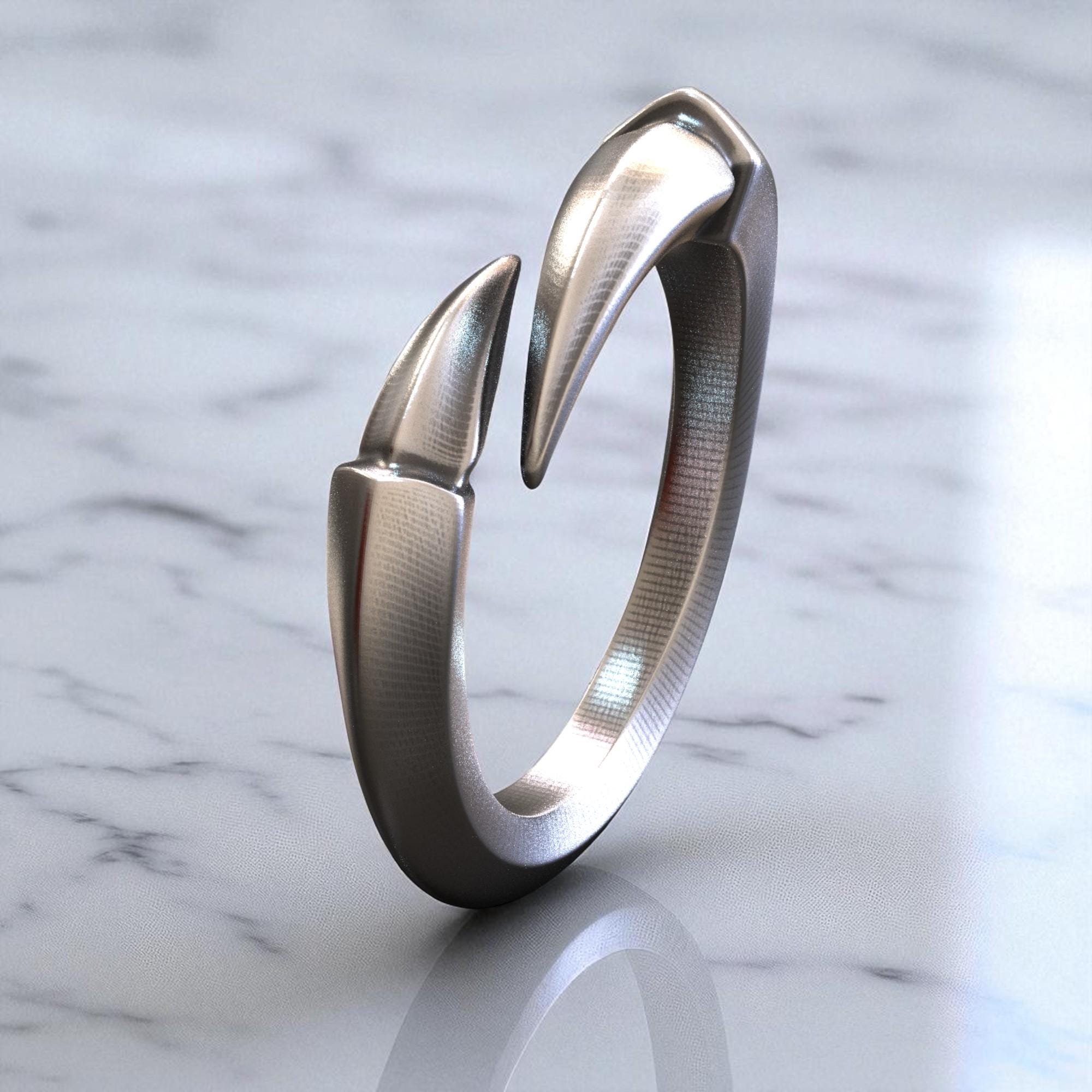 ハンドクラフトのスターリングシルバー製タロンクローリング