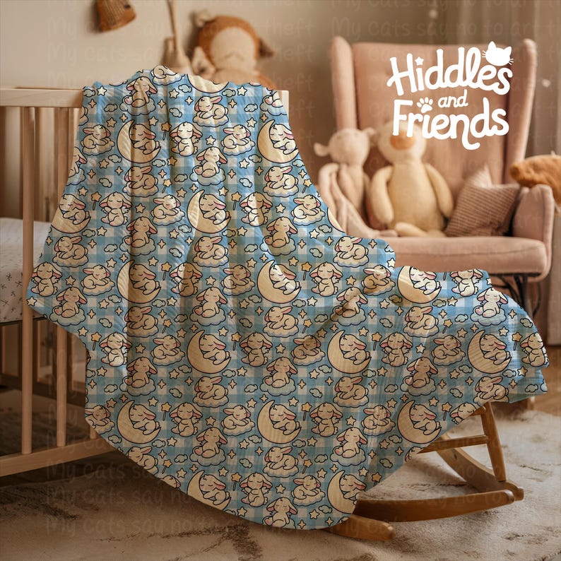 May include: A blue and white baby blanket with a repeating pattern of bunnies sleeping on clouds and moons. The blanket is made of soft, plush fabric and is perfect for cuddling.