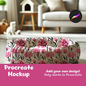May include: A white oval-shaped pet bed with a pink floral pattern. The bed is on a wooden floor. Procreate Mockup. Add your own design! Only works in Procreate.