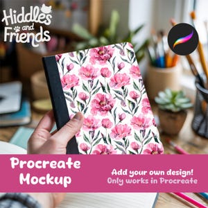 May include: A notebook with a floral design featuring pink flowers and green leaves on a white background. The notebook has a black spine and the text "Procreate Mockup" is visible. The image also includes the text "Add your own design! Only works in Procreate."