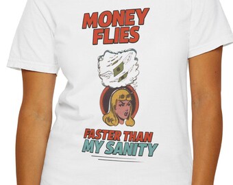 May include: White t-shirt with a red and blue graphic print that says "Money Flies Faster Than My Sanity". The graphic features a cartoon woman with money flying around her head.