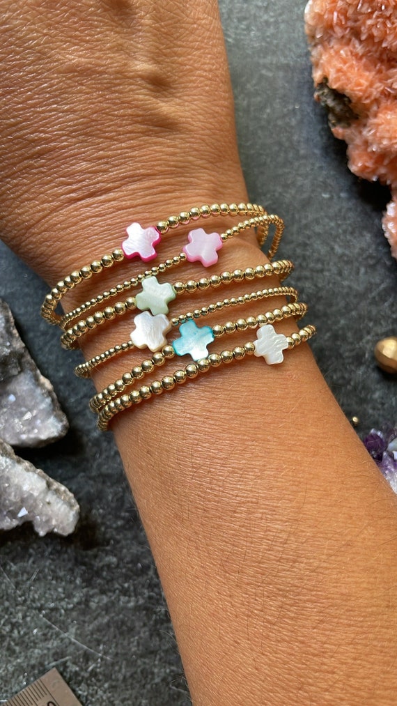 GLASS BEAD RING 2 MM ORANGE & PINK W/CROSS CHARM GLASS BEAD RING 2 MM ORANGE & PINK W/CROSS CHARM