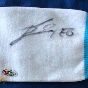 Lionel Messi signed soccer sock with COA