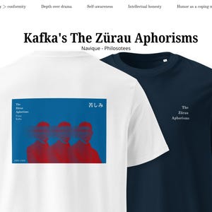 May include: Two t-shirts, one white and one navy blue. The white t-shirt features a blue rectangle with red figures and Japanese text. The navy blue t-shirt has the text "The Zürau Aphorisms".
