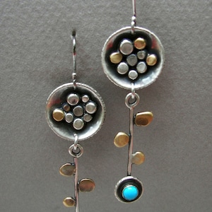 Dangling flower earrings: Long sterling silver and brass abstract flower earrings with leaves and 4 mm turquoise stone