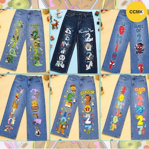 May include: Six pairs of blue denim jeans featuring various graphic prints. Each pair displays the text "SENIOR" and "CLASS OF 2027" integrated with colorful cartoon character designs, including Disney princesses, Frozen characters, Spider-Man, Winnie the Pooh, and Toy Story.