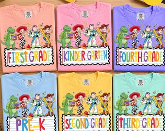 May include: Six colorful t-shirts featuring Toy Story characters including Rex, Jessie, Buzz Lightyear, and Woody. Each shirt displays a different grade level text: First Grade, Kindergarten, Fourth Grade, Pre-K, Second Grade, and Third Grade.
