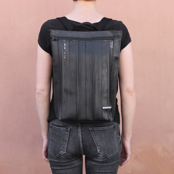 Stylish vegan backpack for woman features waterproof and recycled inner bicycle tube.