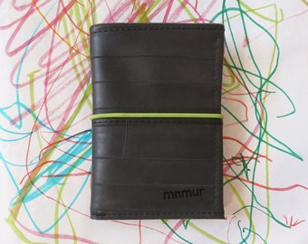 Small trifold wallet with lemon green elastic band closure and coin pocket, handmade from recycled inner bike tubes.