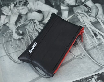 Small red zipper pouch made from recycled bicycle inner tube. Vegan coin purse. Dimensions: 10 x 6 cm (3.9 in x 2.3 in).