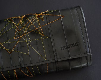 Recycled inner tube women's wallet with colored stitching. Sustainable clutch purse, vegan friendly, handmade in Italy.