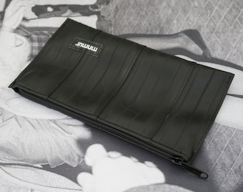 Large black  zipper pouch made from recycled bicycle inner tubes.