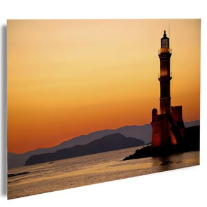 Sunset and a lighthouse Chania Harbor, Crete, Greece