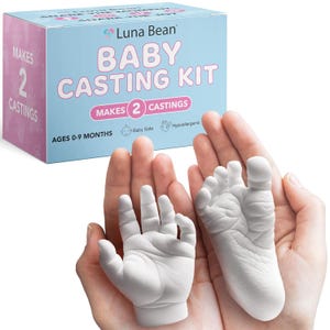 May include: A baby casting kit with a hand and foot cast. The kit box is light blue and pink with the words "Baby Casting Kit" and "Makes 2 Castings". The casts are white and held in open hands. The kit is for ages 0-9 months and is baby safe and hypoallergenic.