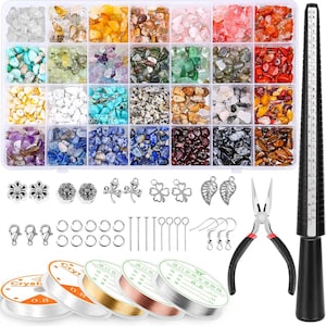May include: A set of 24 small containers filled with various colored gemstones, along with jewelry making supplies including jump rings, head pins, earring hooks, wire, and a ruler.