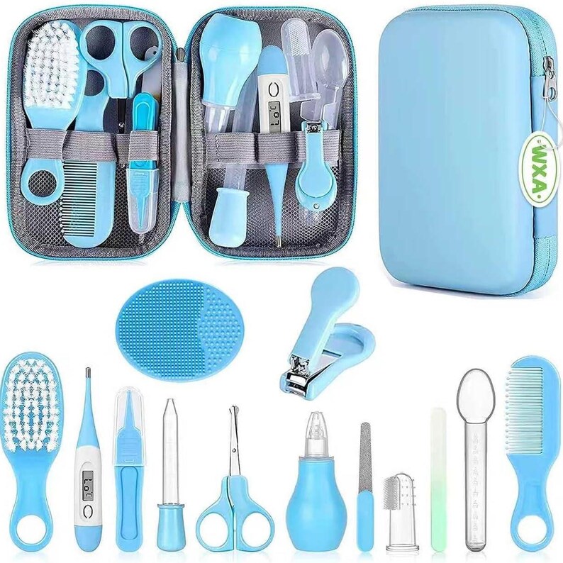 May include: A light blue baby grooming kit with a zippered case. The kit includes a brush, comb, scissors, nail clippers, a thermometer, and other baby care essentials. The case is light blue with a zipper closure.