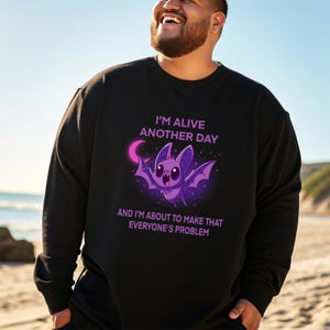 Bat Sweatshirt, Bold Flying Bat Graphic with "I'm Alive Another Day" Quote, Casual Wear for Everyday Comfort, Halloween Gift for Him or Her