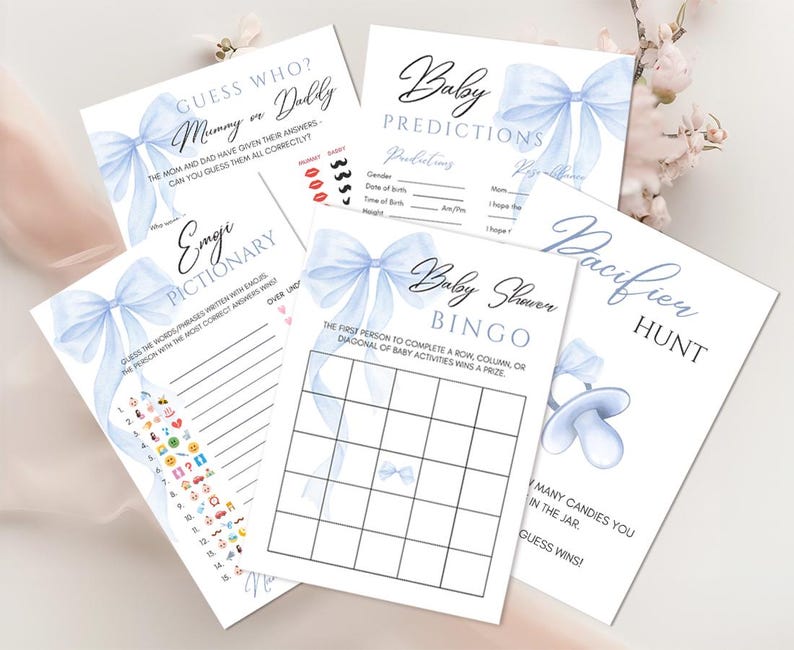 May include: A set of blue and white baby shower game cards with a watercolor bow design. The games include Guess Who, Emoji Pictionary, Baby Shower Bingo, and Pacifier Hunt.