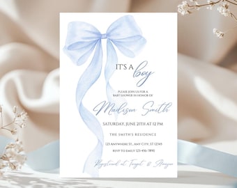 May include: A baby shower invitation with a light blue watercolor bow and the text "It's a boy". The invitation includes the name "Madison Smith", the date and time of the shower, the location, and RSVP information. It also mentions that gifts can be registered at Target and Amazon.