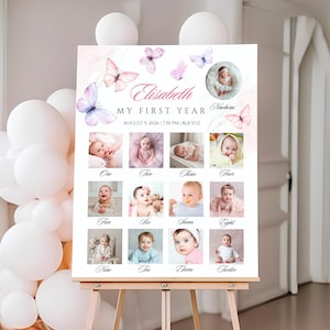 Puede incluir: Un póster de hitos para bebés personalizado en un caballete. El póster presenta un collage de fotos de bebés, mariposas y el texto "Elisabeth, My First Year". El diseño incluye mariposas de acuarela rosas y moradas.