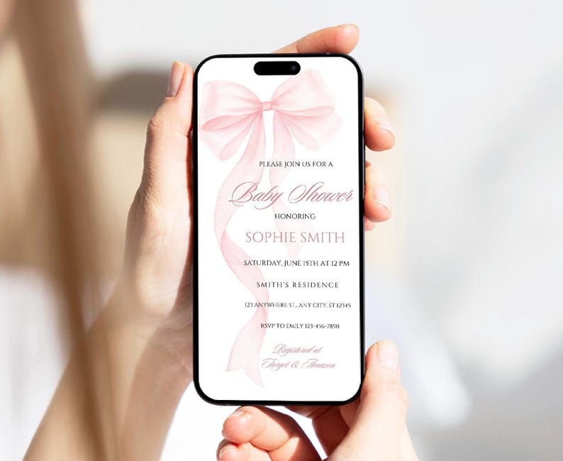 May include: A pink baby shower invitation with a watercolor bow and the text "Please join us for a Baby Shower honoring Sophie Smith. Saturday, June 15th at 12 PM. Smith's Residence 123 Anywhere St. Any City, ST 12345. RSVP to Emily 123-456-7890. Registered at Target & Amazon."