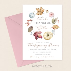 May include: Thanksgiving dinner invitation card with watercolor pumpkins, leaves, and the text "Let's be thankful together." The invitation is 5 x 7 inches and includes event details and RSVP information. A pink envelope is in the background.