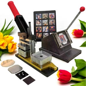 May include: A black and gold button maker with a red handle and a lever. The machine is used to create custom buttons with images or designs. The machine is shown with a variety of button blanks and a sample button with a colourful image.