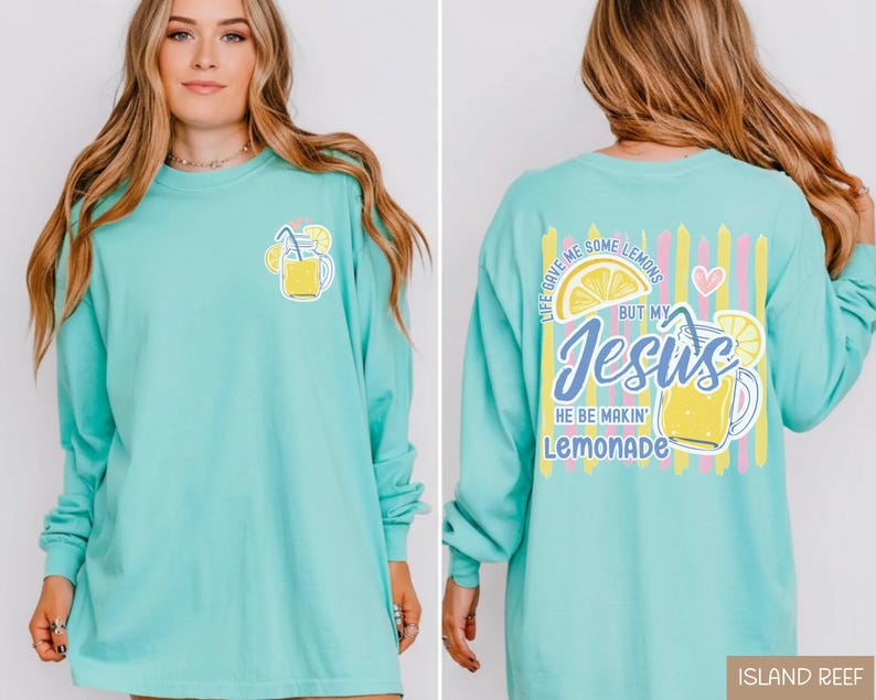 May include: A light turquoise long-sleeve shirt with a lemonade graphic on the front and back. The front features a lemonade glass with lemons and a straw. The back has the text "Life gave me some lemons but my Jesus he be makin' lemonade."