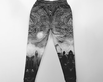 May include: Black and white sweatpants with a geometric pattern featuring a mandala design and crystal shapes.