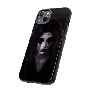 May include: Black iPhone case with a graphic of a woman with dark hair and a pale face. Her eyes are black and she has dark makeup. The background is a dark purple.