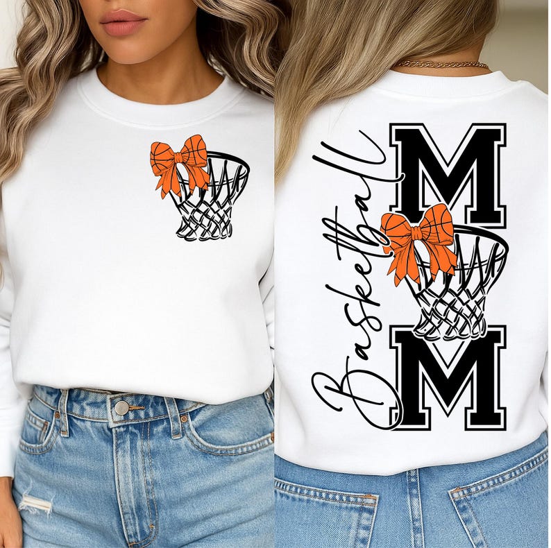 Puede incluir: Sudadera blanca con un dise&ntilde;o de red de baloncesto y lazo naranja. La parte trasera muestra la palabra "Basketball" en cursiva, con "MOM" en letras negritas, y otra red de baloncesto con un lazo naranja.