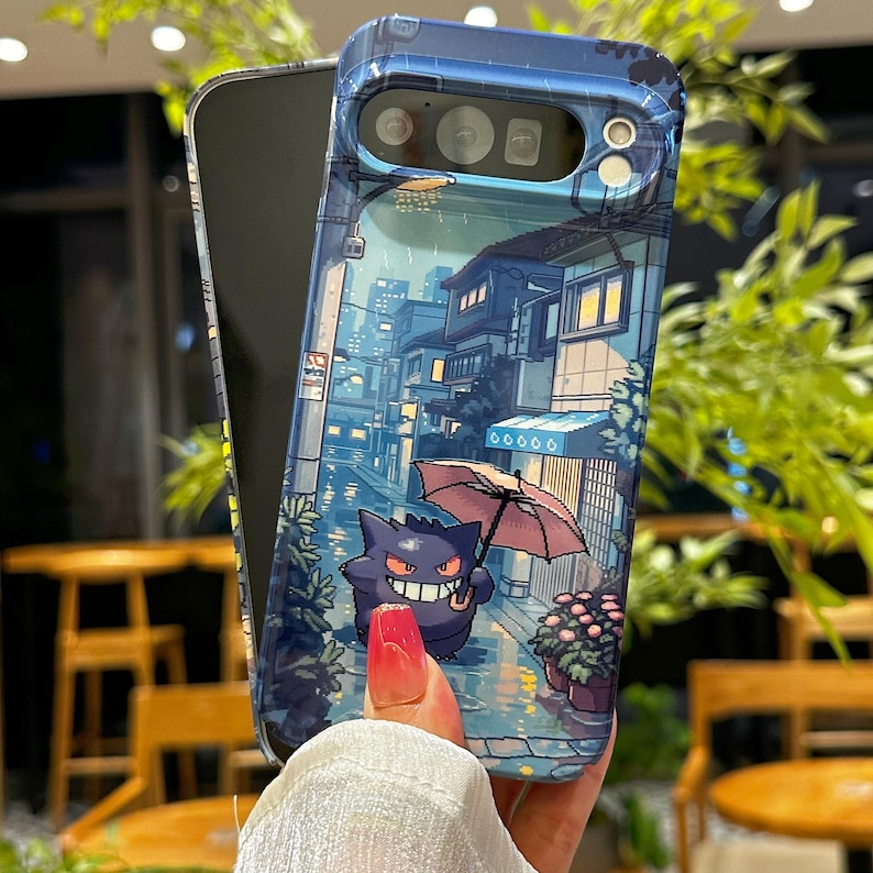 May include: A clear phone case featuring a colorful illustration of a purple cartoon character holding an umbrella in a rainy street scene. The case has a blue border and is wrapped around a black phone.