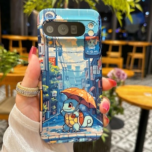 May include: A pixelated phone case featuring a blue and white street scene with a cartoon turtle holding an orange umbrella. The case has a glossy finish and a camera cutout.