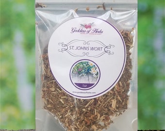 May include: A clear plastic bag containing dried St. John's Wort herb. The bag has a white label with the text "Goddess of Herbs" and "St. John's Wort" in purple lettering. The label also includes a small image of flowers and the text "1 oz" and "www.goddessofherbs.com".