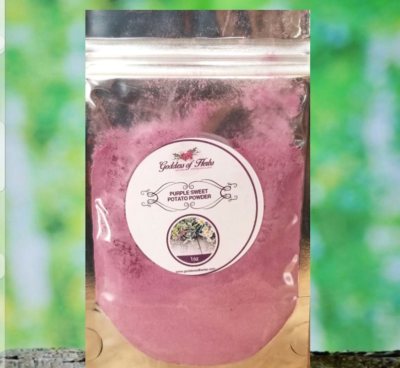 May include: A small resealable pouch containing purple sweet potato powder. The pouch has a label that reads "Goddess of Herbs" and "Purple Sweet Potato Powder". The label also includes a small image of a purple sweet potato plant. The pouch contains 1 oz of powder.
