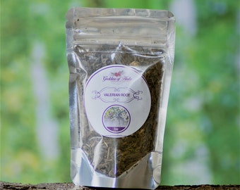 May include: A silver resealable pouch containing dried valerian root. The pouch has a white label with purple text that reads "Goddess of Herbs" and "Valerian Root". The label also includes a small image of a flower.