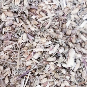 May include: Close-up of a mixture of dried herbs and seeds, including brown stems, light brown seeds, and small green leaves.