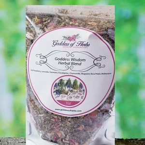 May include: A clear plastic bag filled with a blend of dried herbs, labeled "Goddess Wisdom Herbal Blend". The label lists the ingredients: Red Raspberry, Lavender, Damiana, Eucalyptus, Chamomile, Mugwort, Rose Petals, Motherwort. The bag is labeled "Goddess of Herbs" and includes the website address "www.goddessofherbs.com".