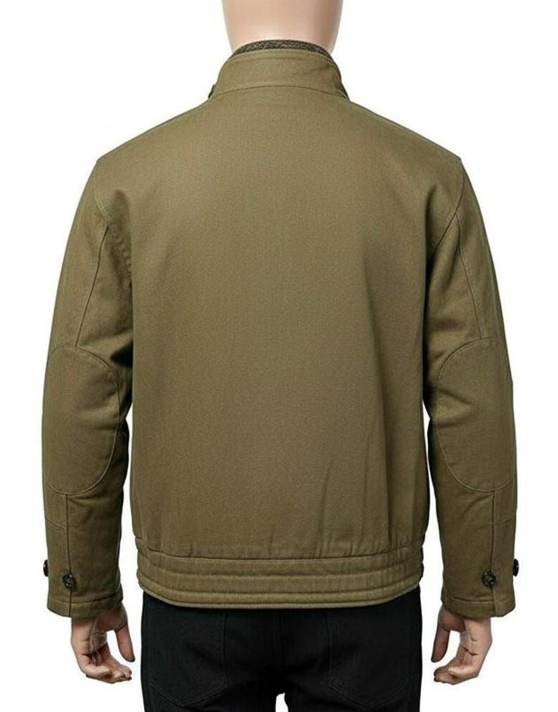 May include: Olive green jacket with a stand-up collar, buttoned cuffs, and elbow patches. The jacket has a ribbed hem and a simple, classic design. The back view showcases the jacket's tailored fit and durable fabric.