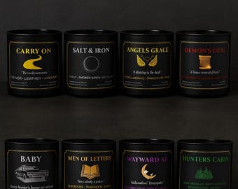 May include: Eight black cylindrical candles with labels featuring gold, white, red, purple, and green text and graphics. The labels include titles like Carry On, Salt & Iron, Angels Grace, Demon's Deal, Baby, Men of Letters, Wayward AF, and Hunters Cabin.