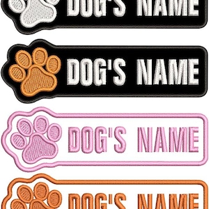 May include: Embroidered dog name patches in black, pink, and orange, each featuring a paw print design. The text "DOG'S NAME" is displayed in white or orange thread. These patches are ideal for pet owners.