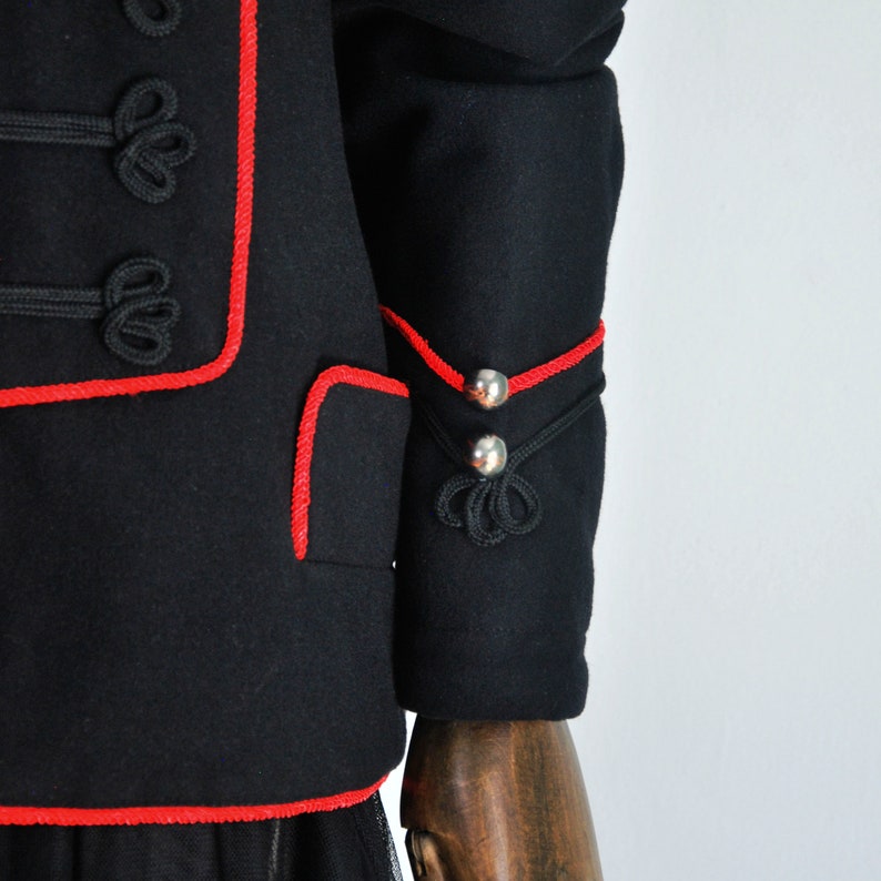 Frog closing Black color with red trim CASTELBAJAC men jacket Military style Wool and viscose. Epaulettes on the shoulders