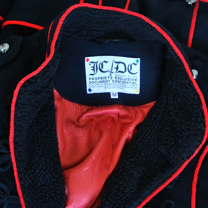 Frog closing Black color with red trim CASTELBAJAC men jacket Military style Wool and viscose. Epaulettes on the shoulders