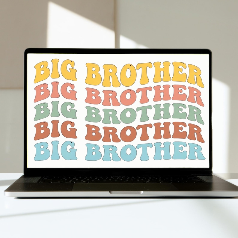 May include: A laptop displays the words "BIG BROTHER" in a repeating pattern. The text is in a retro font, with each line in a different color: yellow, coral, green, orange, and blue. The laptop is on a white surface.